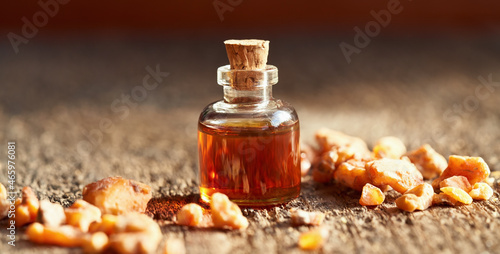 Photos A bottle of styrax benzoin essential oil with benzoin resin