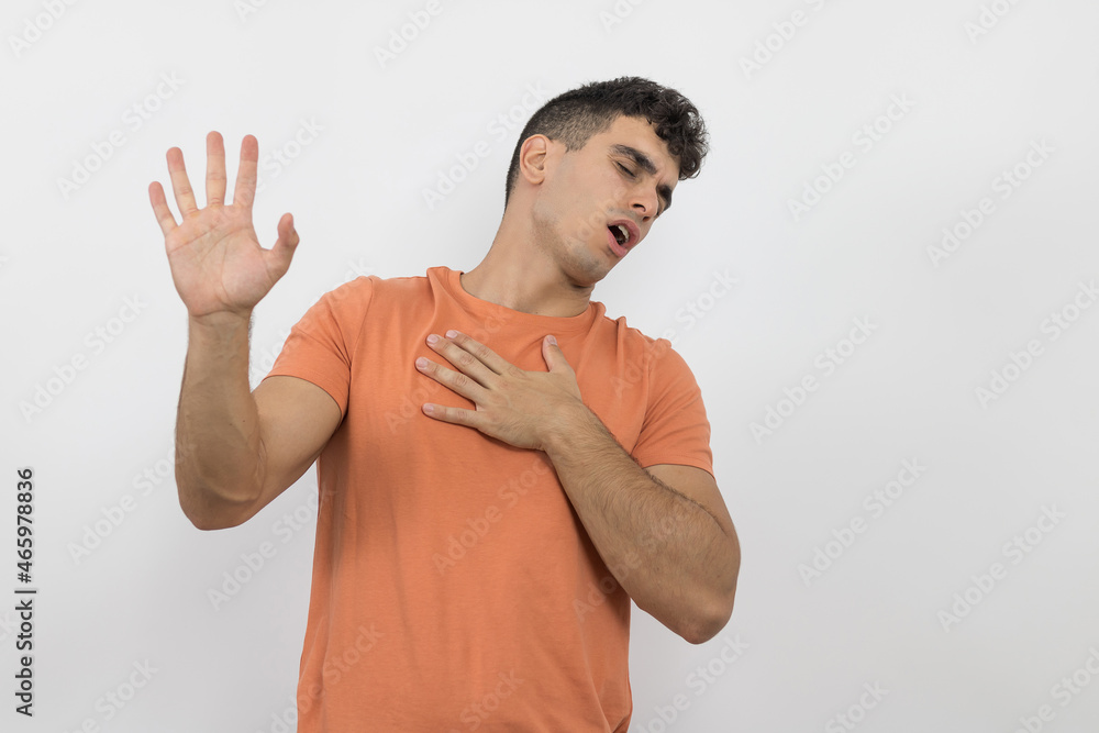 Fototapeta premium a handsome young man making a gesture complaining about something on a white background.