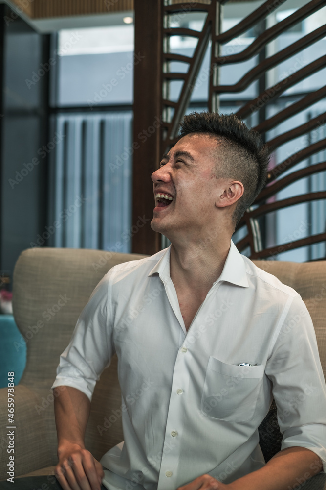 Portrait of asian young handsome man in black shirt sitting in coffee shop and smiling. Lovely smile, Happy person, millennials life, lifestyle Portrait of asian young handsome man in black shirt sitting in coffee shop and smiling. Lovely smile, Happy person, millennials life, lifestyle