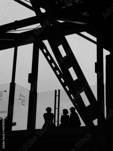 silhouette of a person in a Steel beam building