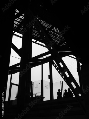 silhouette of a person in a Steel beam building