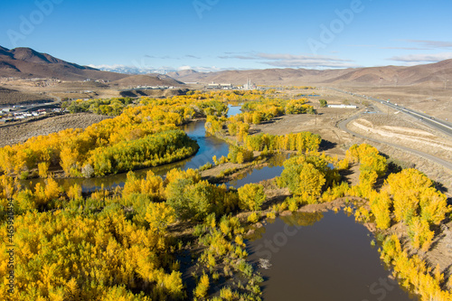 Aerial view of the Truckee River east of Reno Nevada with a winding river and colorful trees in Autumn.