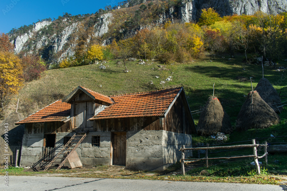 Rural landscape in a mountain village. Stables and huts, straw for cattle feed. Autumn colors. Rural landscape in a mountain village. Stables and huts, straw for cattle feed. Autumn colors.
