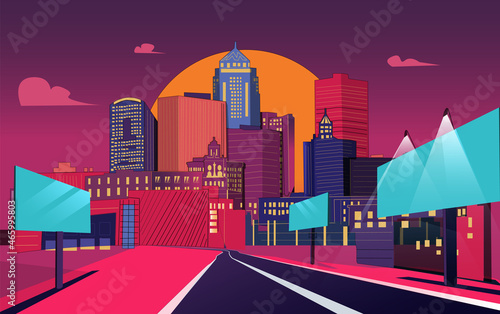 Bright colored cityscape. Street of town city with road , many .high-rise buildings, skyscrapers. Big boards with glowing bulbs. Empty downtown road. Sunset, evening