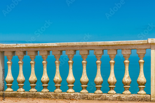 Old balustrada against the background of the sea in beautiful sunny weather