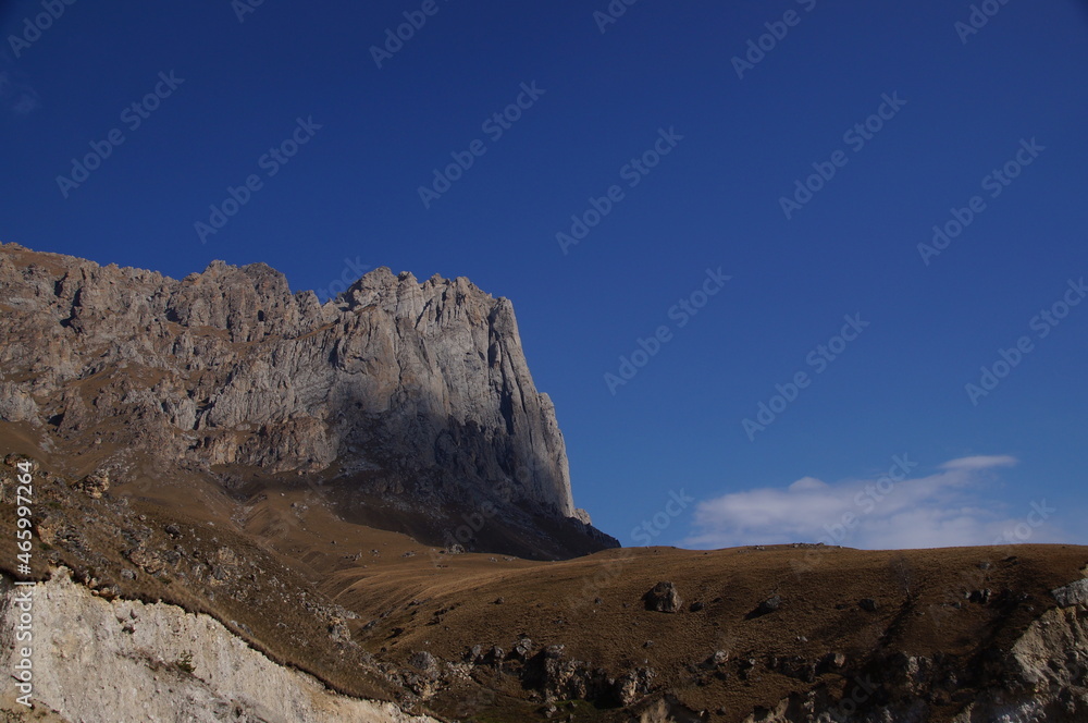 Mountain view on a clear autumn day. Mountains in Ingushetia. Landscape in the mountains in autumn. Base jumping mountain. 