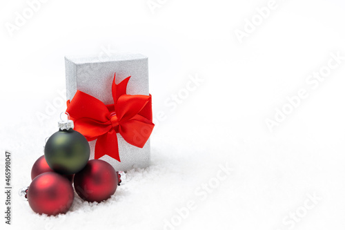 Horizontal christmas decoration on white background and snow