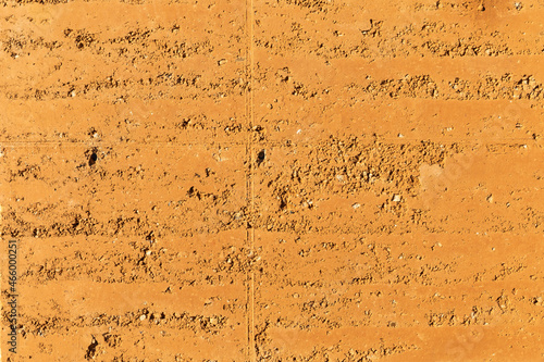 Rammed earth, an old building technique used to create the walls of a house by pressing sand into blocks. Sustainable and ecological textured material to build with. Future concept for housing