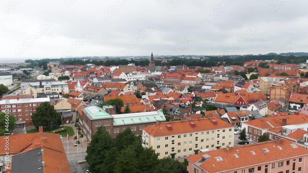 Colorful city of Ystad with red rooftops and church tower, aerial drone view Colorful city of Ystad with red rooftops and church tower, aerial drone view