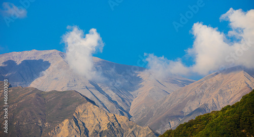 Caucasus mountains in the clouds during the day