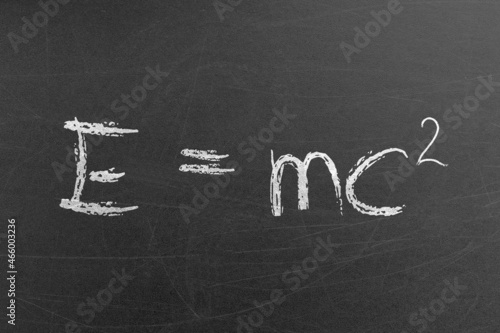 Photo Relativity equation E mc2 handwritten by chalk on a university blackboard
