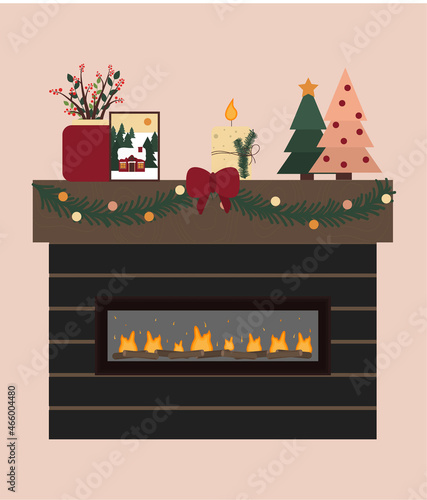 Modern indoor fireplace with wood decoration for Christmas holiday. Beautiful bonfire at home.