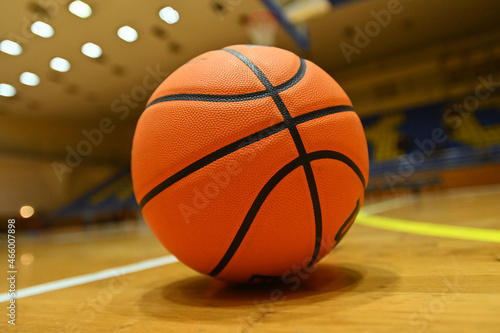 Basketball ball on the court in sport arena © vitleo