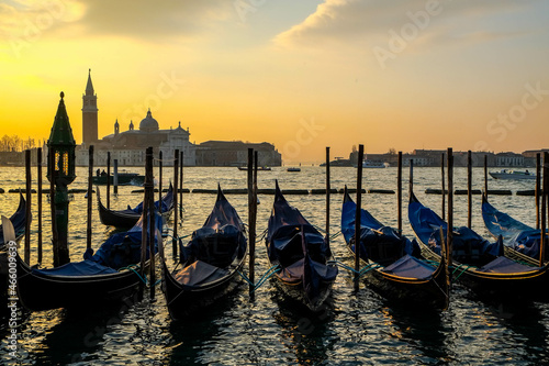 Gondolas on the jetty of San Marco square in Venice at sunset © joan