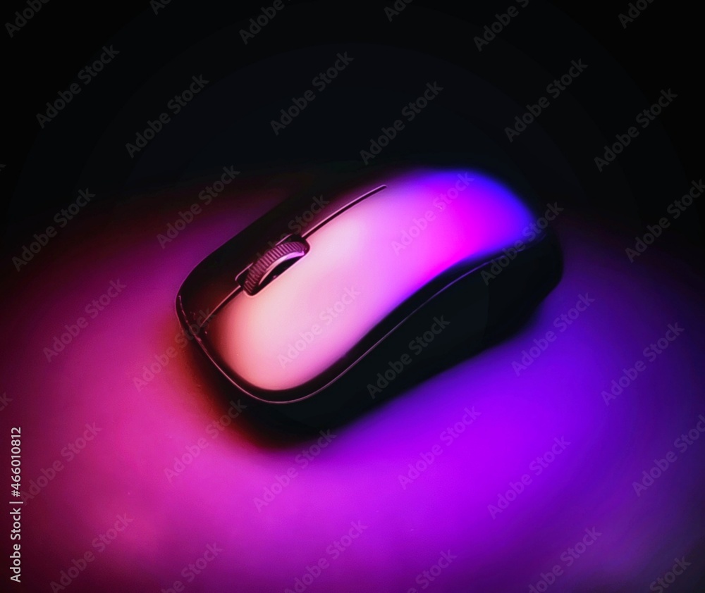 Long exposure, low light image of a computer mouse