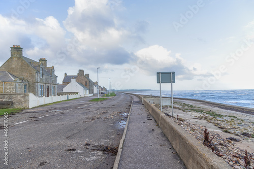 A Scottish seatown village road cover of stones after a major storm  photo