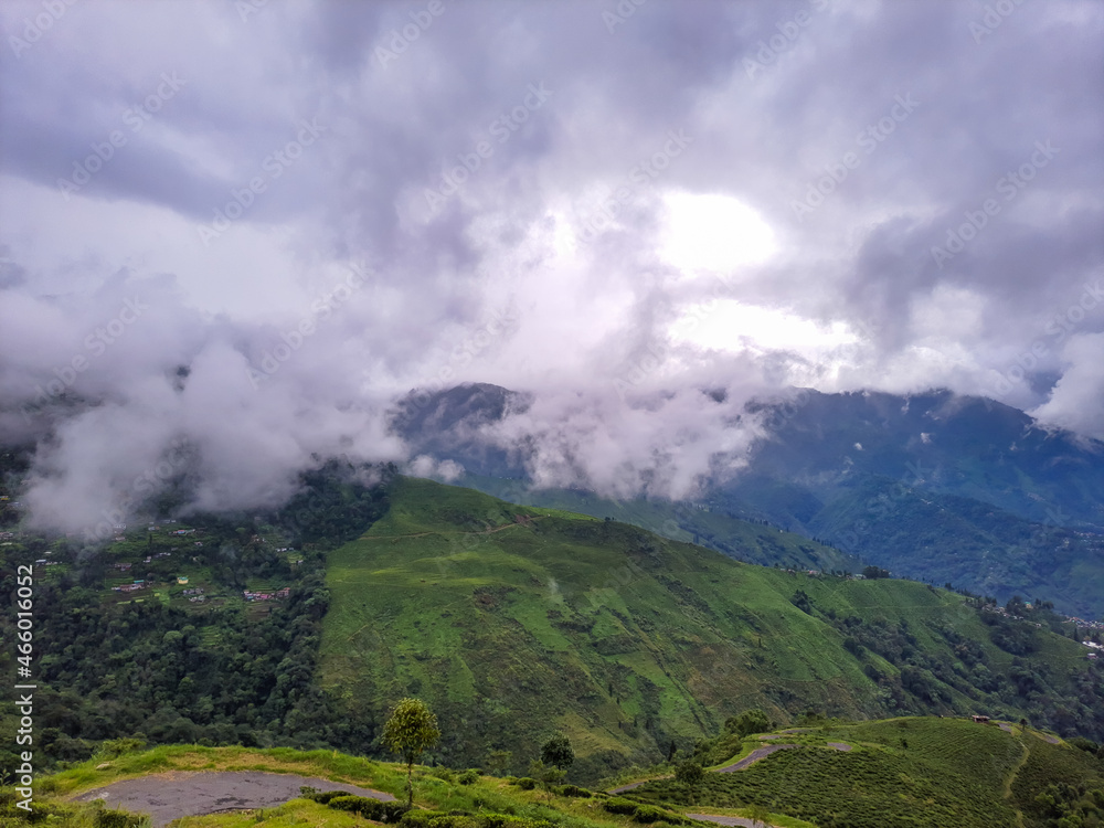 Obraz premium green mountain with dramatic sky at morning from hill top