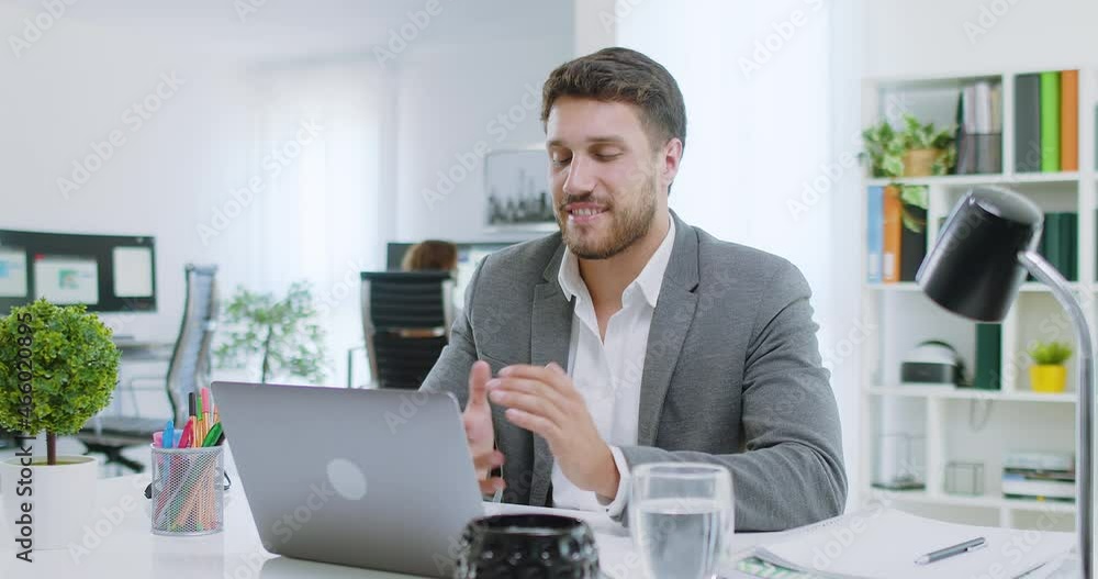 Lateral Dolly of Happy Caucasian Young Business Man in Video Conference Call at Office.
Job Interview, Online Learning, Teleworking, Webinar Concept. Lateral Dolly of Happy Caucasian Young Business Man in Video Conference Call at Office.
Job Interview, Online Learning, Teleworking, Webinar Concept.