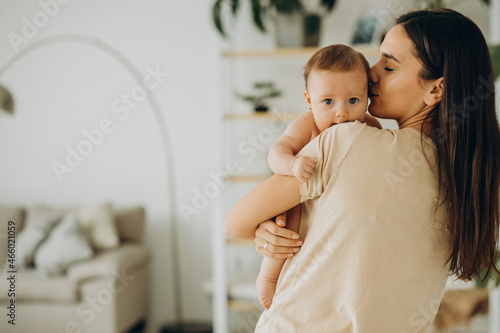 Mother with her baby girl at home