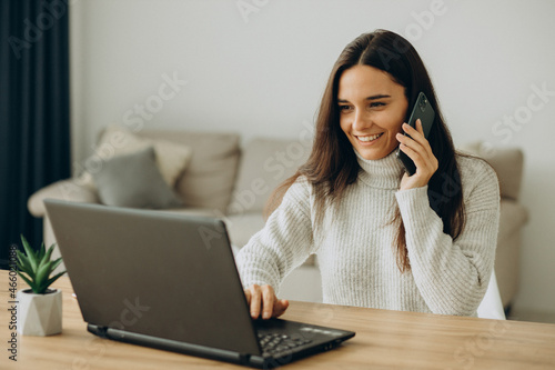 Woman working on computer from home