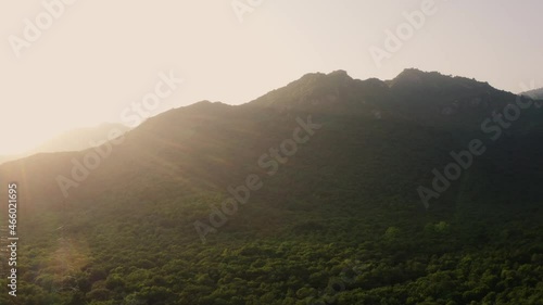 Aerial view of green hills with sunshine covering the landscape in Margalla Hills Islamabad, Pakistan photo