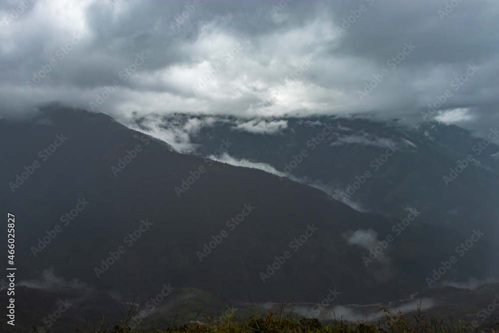 misty mountains with dramatic cloudy sky at morning in rainy day misty mountains with dramatic cloudy sky at morning in rainy day