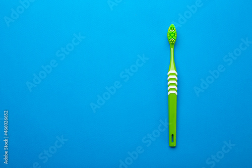 Toothbrush on a blue background. Health care  dental hygiene. Space for text.