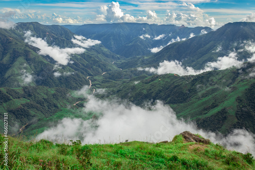 mountain range valley filled with low clouds with dramatic sky at morning © explorewithinfo