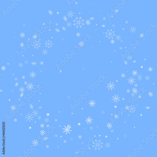 White delicate openwork snowflakes are scattered on a blue background. Festive background  postcard design  wallpaper