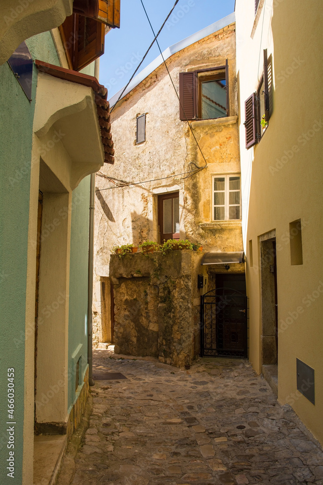 Houses in a quiet residential street in the historic medieval centre of Krk Town on Krk Island in the Primorje-Gorski Kotar County of western Croatia
