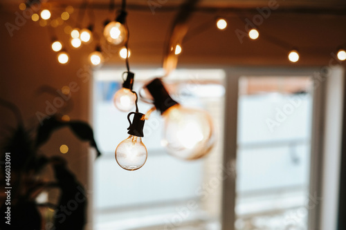photo of a garland of light bulbs on a dark background. selective focus. christmas and new year concept 