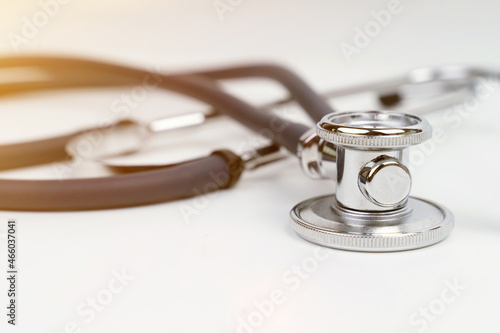 On a white background stethoscope. Close-up, flare.