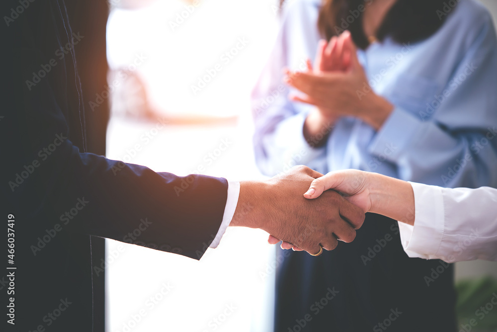 Picture holding hands with business partners agreeing to buy and sell real estate Venture International Investment contract, meeting, vision, investment for profit