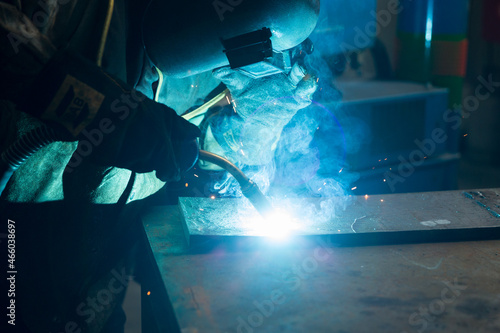 Worker man using gas metal arc welding wearing personal protective quipment