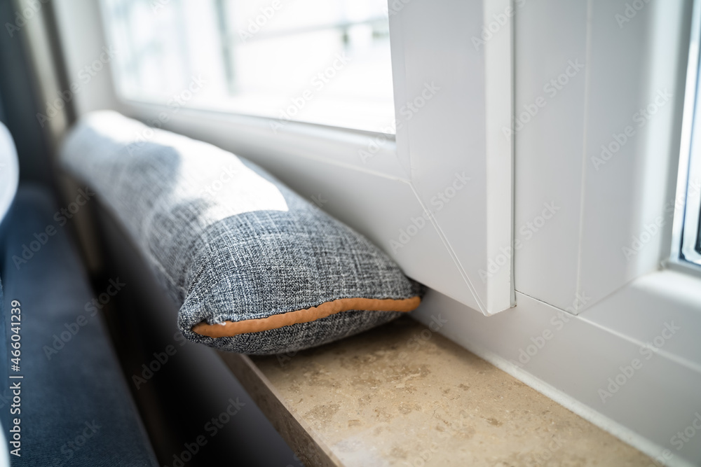 Valokuva Draft Excluder Under Window Blocking Cold Air