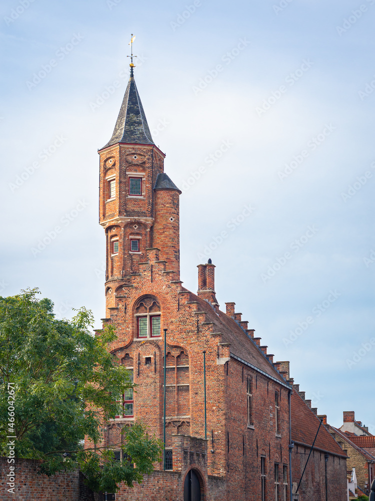 Brugge, Belgium - October 2021: Picturesque building of the Saint Sebastian Archers Guild in the historic city of Bruges, Belgium