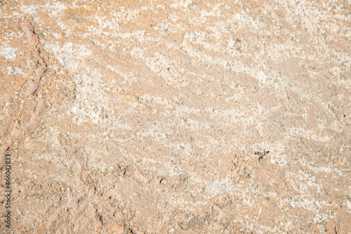 Unusual texture of natural stone with cracks and textures. Natural granite is a mineral stone. Concept - texture for background