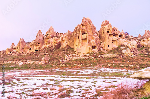 The rocks are full of ancient carved homes, preserved since Byzantine period, Goreme, Cappadocia, Turkey. photo