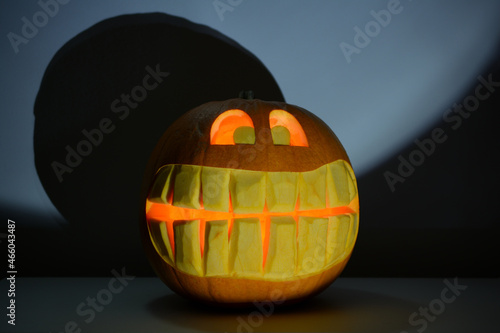 Jack-O'-Lantern, scary Halloween pumpkin lit from within