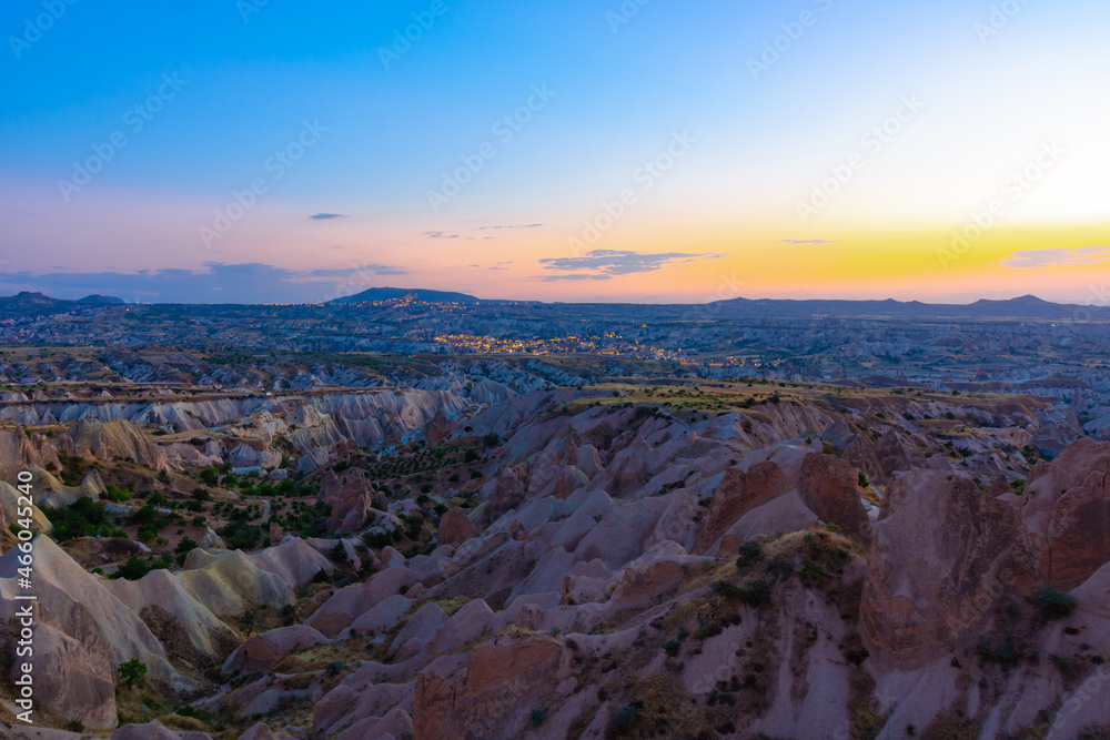 Kizilcukur Valley and Goreme on the background in Cappadocia at Dusk. Cappadocia at sunset. Beautiful sunset view from Kizilcukur valley in Ortahisar Nevsehir Turkey. Visiting Turkey.