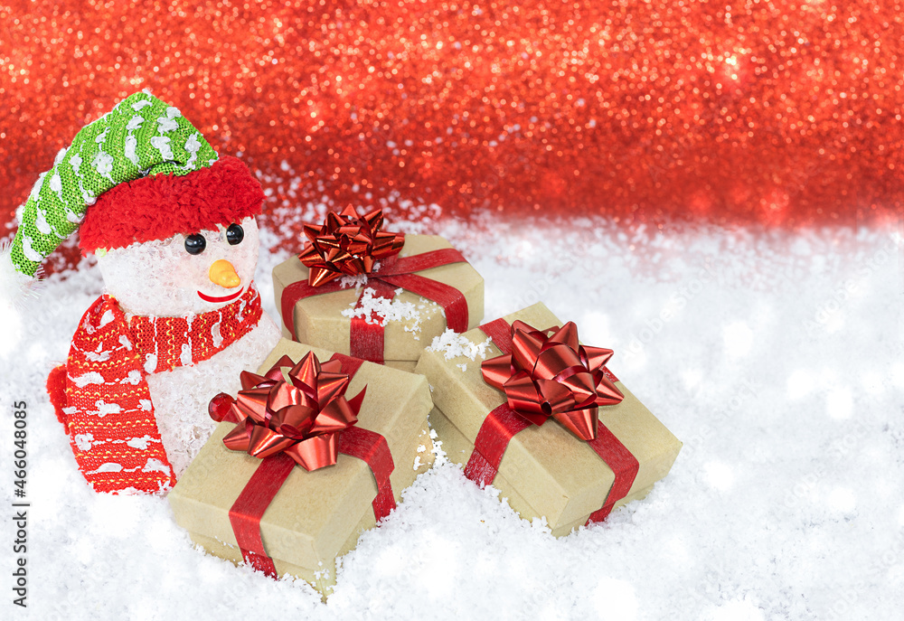 Snowman with gifts in the snow Snowman with gifts in the snow