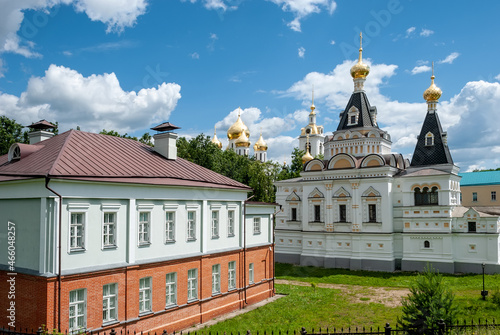 Architectural ensemble "Dmitrovsky Kremlin" on a sunny day, against the background of a blue sky with white, air clouds. Dmitrov. Russia.