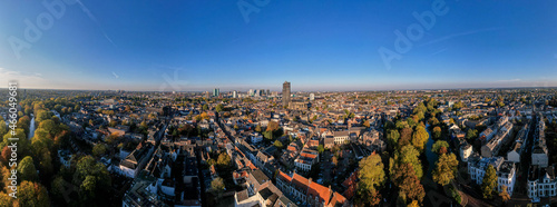 Skyline wide panoramic aerial view of the medieval Dutch city centre of Utrecht with cathedral towering over the city at early morning sunrise. Cityscape in The Netherlands © Maarten Zeehandelaar