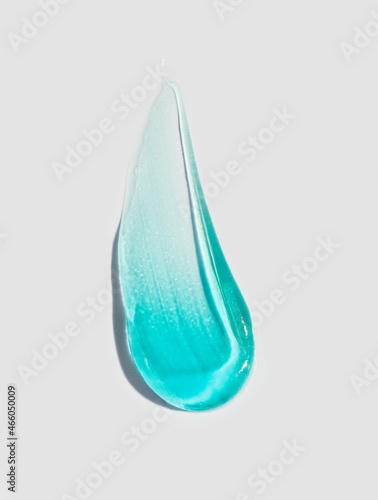 Fotobehang Cosmetic blue gel or foam blurred texture gray background