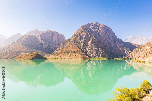 Mountains and blue sky above Iskanderkul Lake. photo