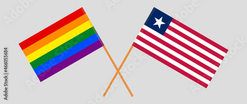 Crossed flags of LGBTQ and Liberia. Official colors. Correct proportion