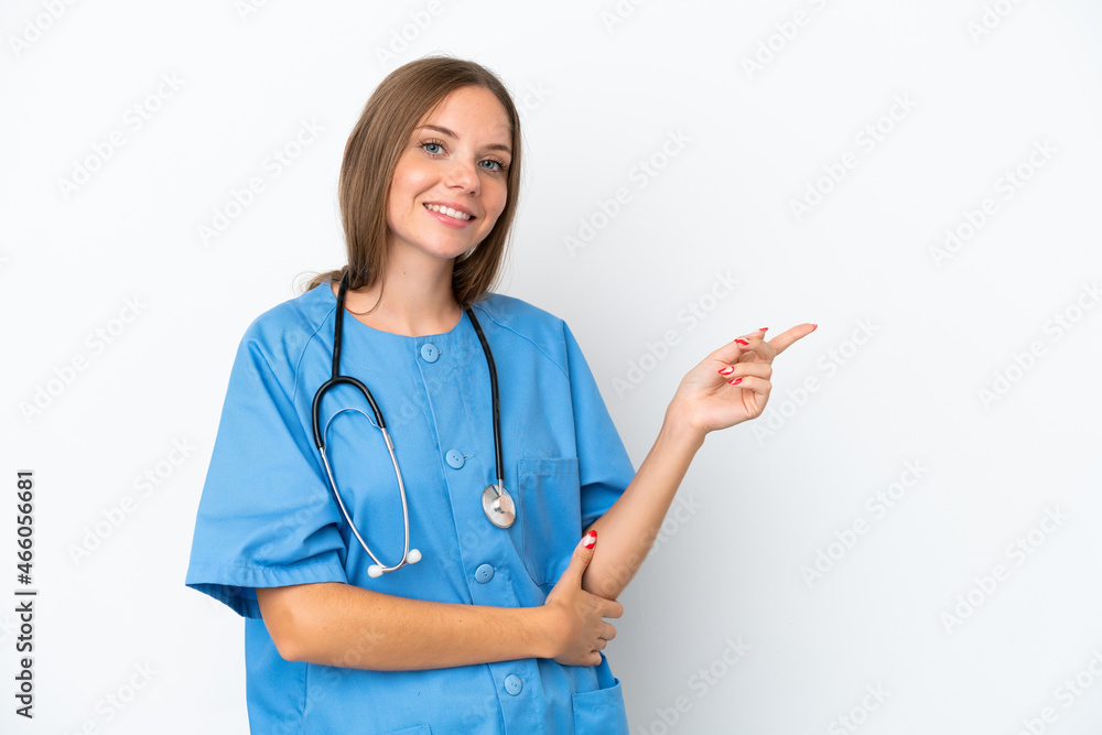 Young surgeon doctor Lithuanian woman isolated on white background pointing finger to the side Young surgeon doctor Lithuanian woman isolated on white background pointing finger to the side