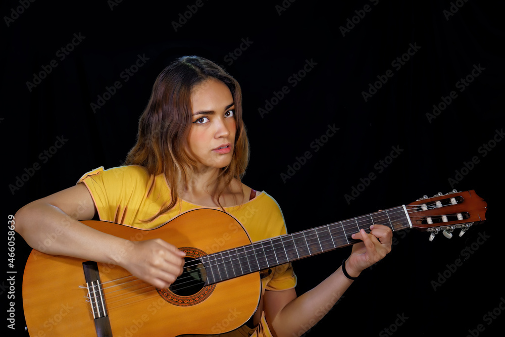 beautiful latin woman playing guitar at studio beautiful latin woman playing guitar at studio