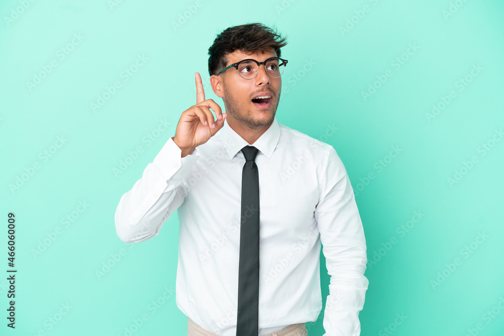 Business caucasian man isolated on blue background intending to realizes the solution while lifting a finger up Business caucasian man isolated on blue background intending to realizes the solution while lifting a finger up