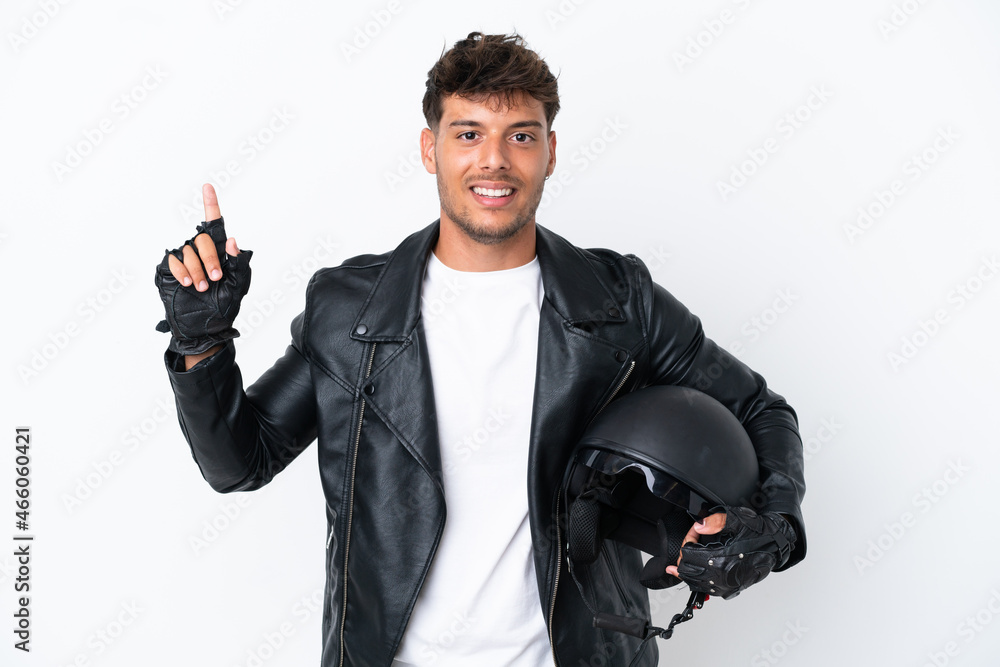 Young caucasian man with a motorcycle helmet isolated on white background showing and lifting a finger in sign of the best Young caucasian man with a motorcycle helmet isolated on white background showing and lifting a finger in sign of the best